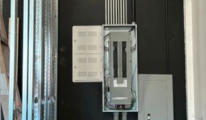 Electrical Panel In Black Wall